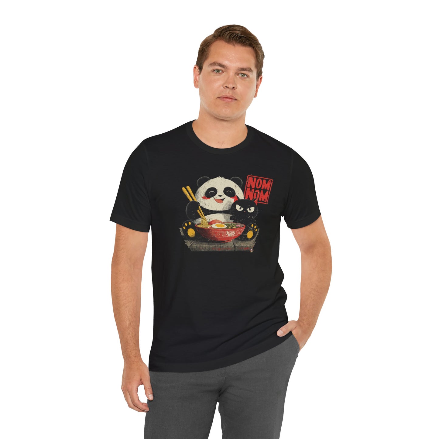 Man wearing Fat Belly Panda “Ramen Nom Nom” unisex panda t-shirt — happy panda with ramen bowl and deadpan cat design on black background for men and women.